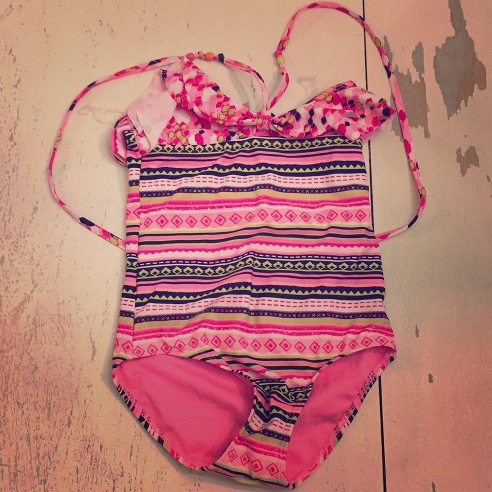 A one piece, multi color, kids bathing suit.